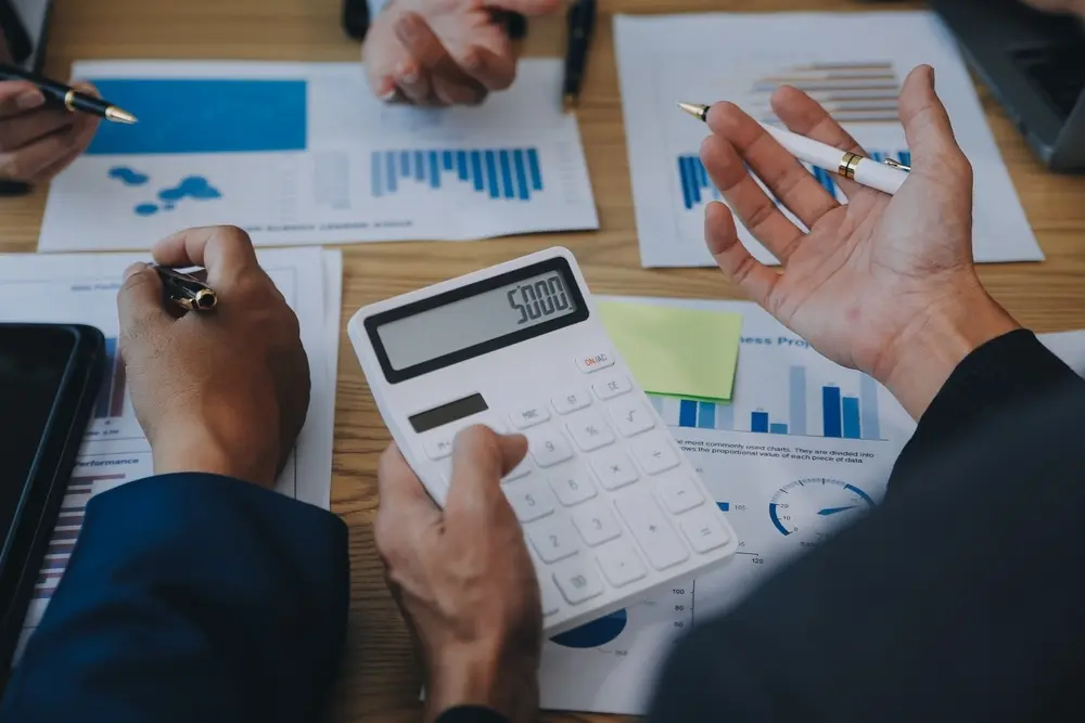 Property management professional reviewing financial reports, budgets, and community accounting records