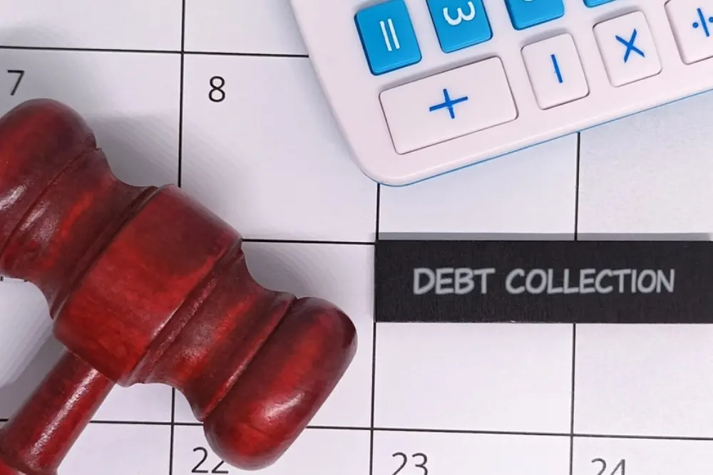 Property manager reviewing homeowner accounts and association collections enforcement procedures